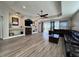 Spacious living room featuring a fireplace, entertainment center, and hardwood floors at 1859 Scarlett Ave, North Port, FL 34289