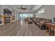 Inviting living room showcasing wood-look floors, a fireplace, and views of the yard at 1859 Scarlett Ave, North Port, FL 34289