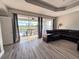 Inviting living room with sliding glass doors opening to a patio and pool area at 1859 Scarlett Ave, North Port, FL 34289
