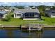 The enclosed lanai and boat lift add value to this waterfront home at 19171 Aviation Ct, Port Charlotte, FL 33948