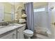 Bathroom features vanity with marble countertop, bathtub, and shower at 1944 Boddington Trl, Port Charlotte, FL 33980