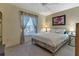 Bedroom with soft light, a bed frame, and neutral walls at 1944 Boddington Trl, Port Charlotte, FL 33980