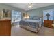 Comfortable bedroom featuring plush carpeting, and soft natural light at 1944 Boddington Trl, Port Charlotte, FL 33980
