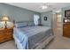 The bedroom offers carpet flooring, a ceiling fan, and natural light at 1944 Boddington Trl, Port Charlotte, FL 33980