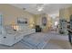 Inviting living room featuring a spacious layout, comfortable seating, and bright natural light at 1944 Boddington Trl, Port Charlotte, FL 33980