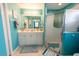 Bathroom with tiled floors, white vanity, and glass enclosed shower at 2002 Bal Harbor Blvd # 311, Punta Gorda, FL 33950