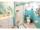 Bathroom with tiled floors, white vanity, and glass enclosed shower at 2002 Bal Harbor Blvd # 311, Punta Gorda, FL 33950