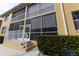 Exterior view of building featuring multiple screened-in patios at 2002 Bal Harbor Blvd # 311, Punta Gorda, FL 33950