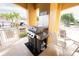 Outdoor grill area for residents' use with a gas grill and a covered seating area at 2002 Bal Harbor Blvd # 311, Punta Gorda, FL 33950