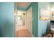 Hallway showing ensuite bathroom with white vanity and tiled shower at 2002 Bal Harbor Blvd # 311, Punta Gorda, FL 33950