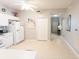 Functional kitchen with white cabinets offers a bright space and seamless transition to the front door at 2002 Bal Harbor Blvd # 311, Punta Gorda, FL 33950