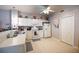 Bright kitchen features white cabinets, tiled flooring, and a full suite of appliances at 2002 Bal Harbor Blvd # 311, Punta Gorda, FL 33950