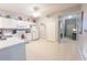 Functional kitchen with white cabinets offers a bright space and seamless transition to the front door at 2002 Bal Harbor Blvd # 311, Punta Gorda, FL 33950