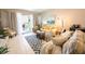 Inviting living room features sliding doors and a comfortable seating arrangement at 2002 Bal Harbor Blvd # 311, Punta Gorda, FL 33950
