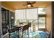 Screened in patio with ceiling fan and dining table for four at 2002 Bal Harbor Blvd # 311, Punta Gorda, FL 33950