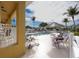 Outdoor pool area with chairs and palm trees at 2002 Bal Harbor Blvd # 311, Punta Gorda, FL 33950
