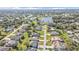 Beautiful aerial shot displaying a residential neighborhood with a scenic lake, and homes with manicured lawns at 206 Santarem Cir, Punta Gorda, FL 33983