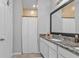 Bright bathroom view showing the tile flooring and granite countertops and the shower stall at 206 Santarem Cir, Punta Gorda, FL 33983