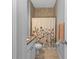 Cozy bathroom features granite countertop, tiled shower and decorative floral curtain at 206 Santarem Cir, Punta Gorda, FL 33983