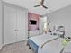 Well-lit bedroom with natural lighting, TV, and ample closet space at 206 Santarem Cir, Punta Gorda, FL 33983
