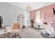 A bright bedroom featuring a pink wall, an overhead light fixture and gray paint at 206 Santarem Cir, Punta Gorda, FL 33983