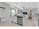 Kitchen island with sink and dishwasher overlooking the living room, perfect for entertaining at 206 Santarem Cir, Punta Gorda, FL 33983