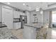 Well-appointed kitchen boasting granite countertops, a stainless steel refrigerator, and a functional island at 206 Santarem Cir, Punta Gorda, FL 33983
