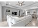 Comfortable living room showcasing a plush sofa, modern entertainment center, and recessed lighting at 206 Santarem Cir, Punta Gorda, FL 33983