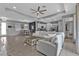 Bright living room featuring tile floors, recessed lighting, and an open layout to dining and kitchen at 206 Santarem Cir, Punta Gorda, FL 33983