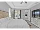 A view of the light and bright main bedroom that shows the tray ceiling and decor at 206 Santarem Cir, Punta Gorda, FL 33983