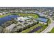 Aerial view of community amenities including a pool, clubhouse, and tennis courts at 2061 Willow Hammock Cir # 105, Punta Gorda, FL 33983