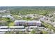 Aerial view of building with carports, landscaping, and community parking at 2061 Willow Hammock Cir # 105, Punta Gorda, FL 33983