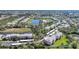 Aerial view of the community reveals attractive landscaping, parking, and several tranquil ponds at 2061 Willow Hammock Cir # 105, Punta Gorda, FL 33983