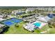 Beautiful aerial view of the community amenities including pool, clubhouse and tennis courts at 2061 Willow Hammock Cir # 105, Punta Gorda, FL 33983