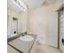 Bathroom featuring vanity with sink and a door to the stacked washer and dryer at 2061 Willow Hammock Cir # 105, Punta Gorda, FL 33983