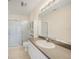 Bathroom featuring a sleek vanity with a bright mirror and glass-enclosed shower at 2061 Willow Hammock Cir # 105, Punta Gorda, FL 33983