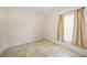 Bright bedroom with tiled floors, closet, and a window providing natural light at 2061 Willow Hammock Cir # 105, Punta Gorda, FL 33983