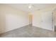 A bright, well-lit bedroom features tile flooring, a ceiling fan, and closet space at 2061 Willow Hammock Cir # 105, Punta Gorda, FL 33983