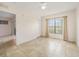 Bright bedroom with tile flooring, a ceiling fan, and a large window with natural light at 2061 Willow Hammock Cir # 105, Punta Gorda, FL 33983