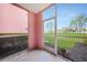 Screened lanai with views of lush landscaping and manicured lawn in a well-maintained community at 2061 Willow Hammock Cir # 105, Punta Gorda, FL 33983