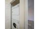Stacked washer and dryer inside a closet at 2061 Willow Hammock Cir # 105, Punta Gorda, FL 33983