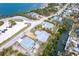Aerial view of a charming home near the bay, surrounded by lush greenery and neighboring houses at 231 Winson Ave, Englewood, FL 34223