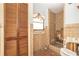 Small bathroom featuring a shower, toilet, sink and window for light at 231 Winson Ave, Englewood, FL 34223