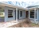 Charming home exterior with a covered entrance, showcasing its architectural details and inviting entryway at 231 Winson Ave, Englewood, FL 34223