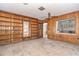 Spacious living room features custom built-in shelving and an open view to the kitchen at 231 Winson Ave, Englewood, FL 34223