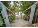 The stairs lead down to a scenic water view surrounded by natural foliage at 231 Winson Ave, Englewood, FL 34223