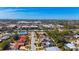 Expansive aerial view showcasing city neighborhoods, mature trees, and glimpses of the ocean at 2521 Clipper Ship Way, Sarasota, FL 34231
