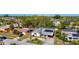 Residential street with mature trees showcasing single-story homes, solar panels, and carports at 2521 Clipper Ship Way, Sarasota, FL 34231