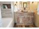 Bathroom showcasing a wooden vanity, a basin sink, and unique fixtures at 2521 Clipper Ship Way, Sarasota, FL 34231