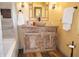Bathroom showcasing a wooden vanity, a basin sink, and unique fixtures at 2521 Clipper Ship Way, Sarasota, FL 34231